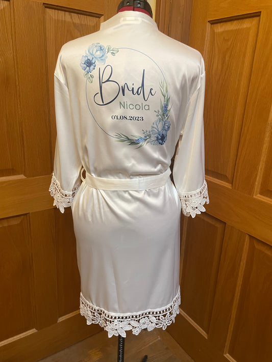 White bridal robe with blue floral bride design. Personalised with name and wedding date.